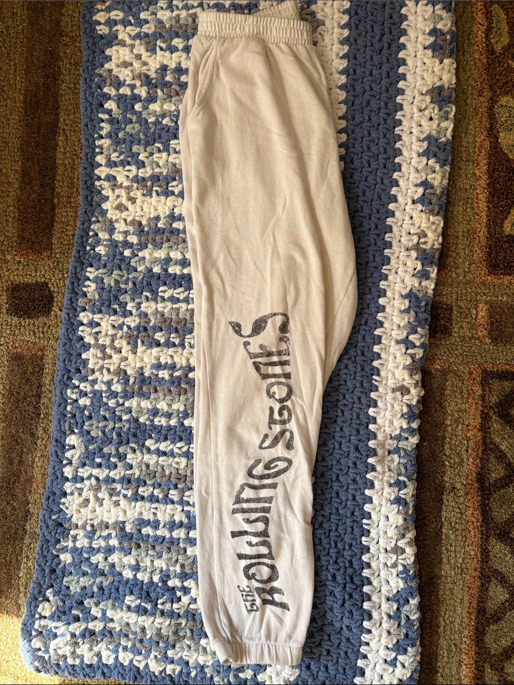 the Rolling Stones Off White Track Pants with Black Logo Leg Graphic